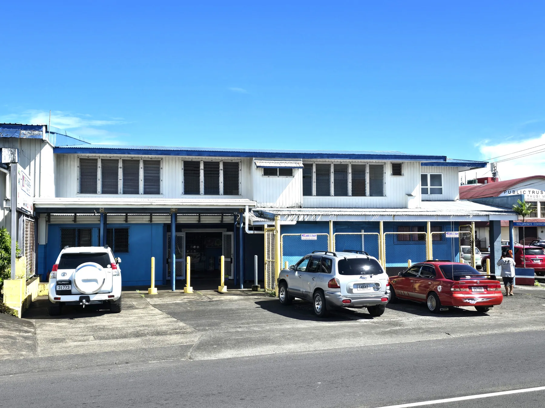 The front entrance and parking area at The Color Shop.